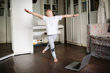 child dancing,aerobics in online video chat laptop
