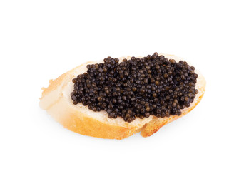 Snack with black caviar isolated on white background