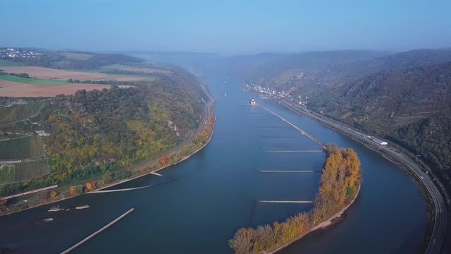 Flight over of autumn Rhine valley near Bacharach town, Germany