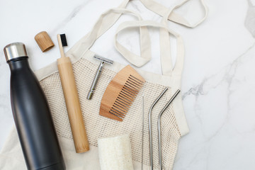 set for eco-friendly living in the style of zero waste. Top view on shopper, wooden toothbrushes,...