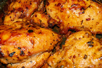Chicken breast baked with spices in the oven. Close up.
