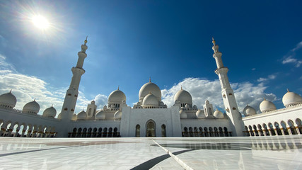 The Sheik Zahed Grand Mosque in Abu Dhabi with a beautiful women in front