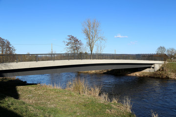 Bridge over a small river in spring