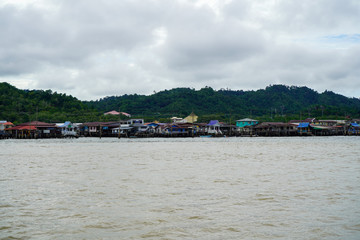 Fototapeta na wymiar The Water Village of Bandar Seri Begawan in the background of Brunei river. November 2019