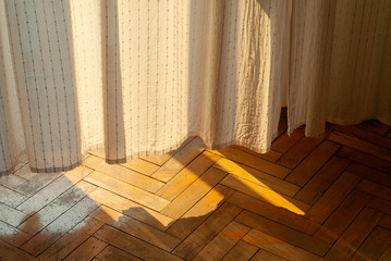 Sunlight through the curtains in the room