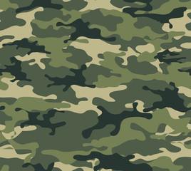 Fototapeta premium Camouflage. From the green spots. Modern design of fabric and clothing.