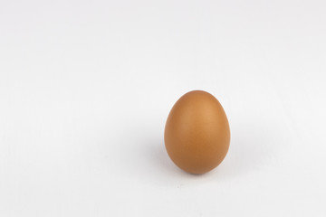 Raw chicken egg isolated on white background, space for text.