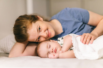 How to put a baby to sleep? Nine-month-old baby sleeping in peace with mom