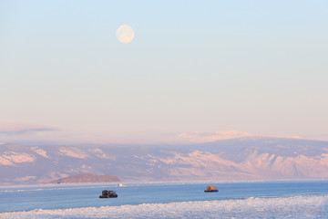 Sailing on the icy lake and full moon