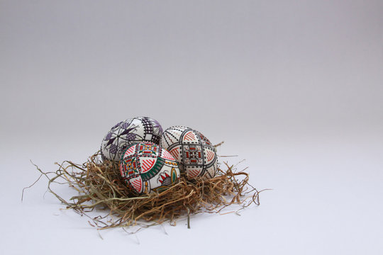 Traditional painted handmade Easter eggs on hay