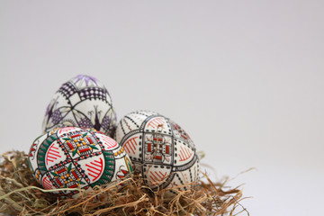 Traditional painted handmade Easter eggs on hay