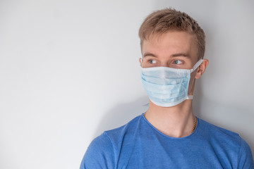 Man in medical mask on white background. Text space