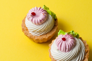Two cakes on a yellow background. Holiday concept, weight control and healthy eating.