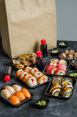 set of sushi rolls in a plastic box, delivered home ready to eat fast healthy food