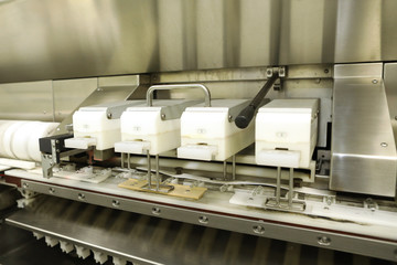 Pharmaceutical industry. Production Line. Machine conveyor with glass bottles, ampoules in a factory. Fill bottles and ampoules for solid particles in liquid and container defects. Pharmaceutical