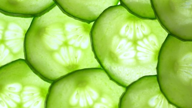 Top view of fresh sliced cucumber rotation