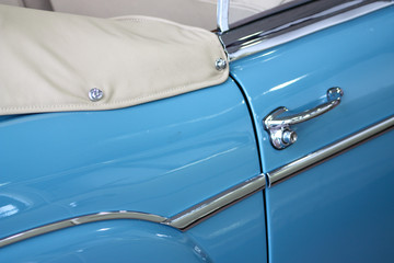 Detail of vintage blue convertible car