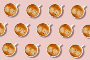 Pattern with white tasty espresso cups on a pink background. Flat lay picture.