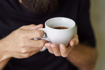  man holding coffee cup