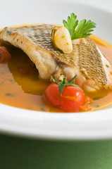 Filetto di Dentice con pomodorini e bisque di pesce