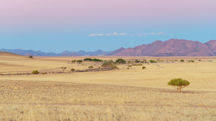 Fototapeta na wymiar Sunset over the Naukluft mountains in the Namib desert, Namibia