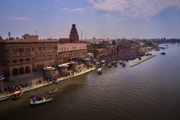 Boats and pilgrims on Ganga in India, aerial drone view