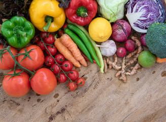 Top view of Organic food on wooden board with copy space , Composition with assorted raw organic vegetables