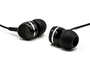 Black earphones isolated on white background. 