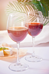 Two glasses with red grape wine. Romantic dinner concept.