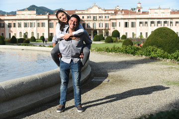 Happy Woman on Man's Shoulders