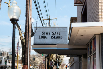Stay safe Long Island written on theater billboard