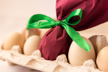 Fototapeta na wymiar Easter bunny paper gift egg wrap diy idea. Easter minimal concept