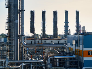 Oil and gas refinery industrial plants with silhouette image. Chemical plant in backlight wuth...