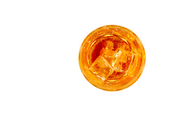 Glass of scotch whiskey and ice over white background.