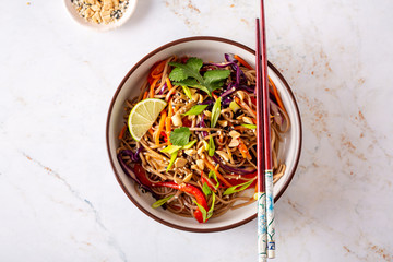 Buckwheat or soba noodle salad with vegetables and peanut sauce - obrazy, fototapety, plakaty