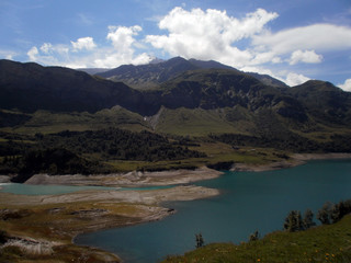 Fototapeta na wymiar View of the lake Roselend, which is mainly a reservoir in the French alpine mountains.