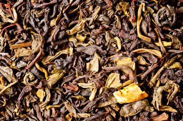 A mixture of black and green tea with vanilla-strawberry flavor, sliced strawberries and rose petals. Background for tea and antioxidants.
