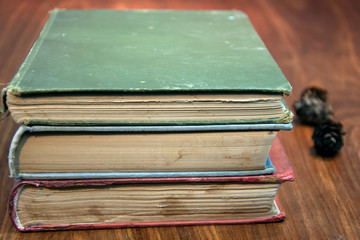 Close-up of old books on wooden table