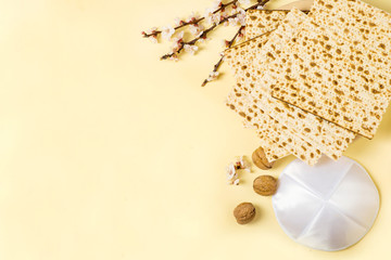 Jewish Passover holiday banner design with wine, mazzo and seder plate on a white background. View from above. Flat lay
