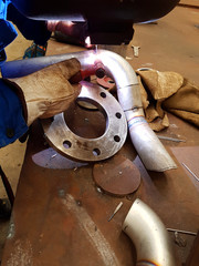 Welding a pipe spool to prefabricate a new stainless steel pipeline
