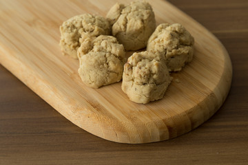 Service delicious Tahini cookies on the wooden background.
