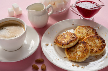 Curd cheese pancakes with jam. Traditional Breakfast with coffee. Healthy Breakfast, proper nutrition.