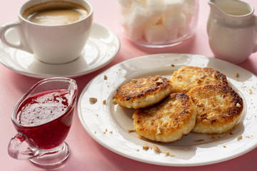 Curd cheese pancakes with jam. Traditional Breakfast with coffee. Healthy Breakfast, proper nutrition.