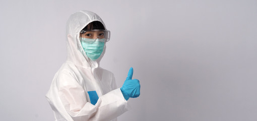 Asian woman doctor in PPE suit with hood and wearing medical mask and gloves for best protection from chemical or virus such as coronavirus or covid-19 and represent virus specialist 