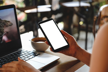 woman using tablet computer in cafe