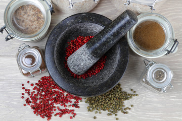 pepper corns and mortar and pestle from top