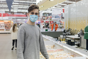 Young man wearing face mask, going for shopping at epidemic coronavirus time.