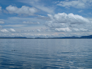View of sky with clouds and water at lake Titicaca, Peru
