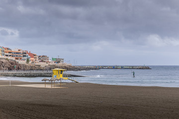 Landmark view of the sea where in the distance waves form in the background of the city and the...