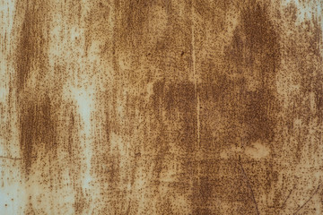 Dirty, painted metal surface with rust.